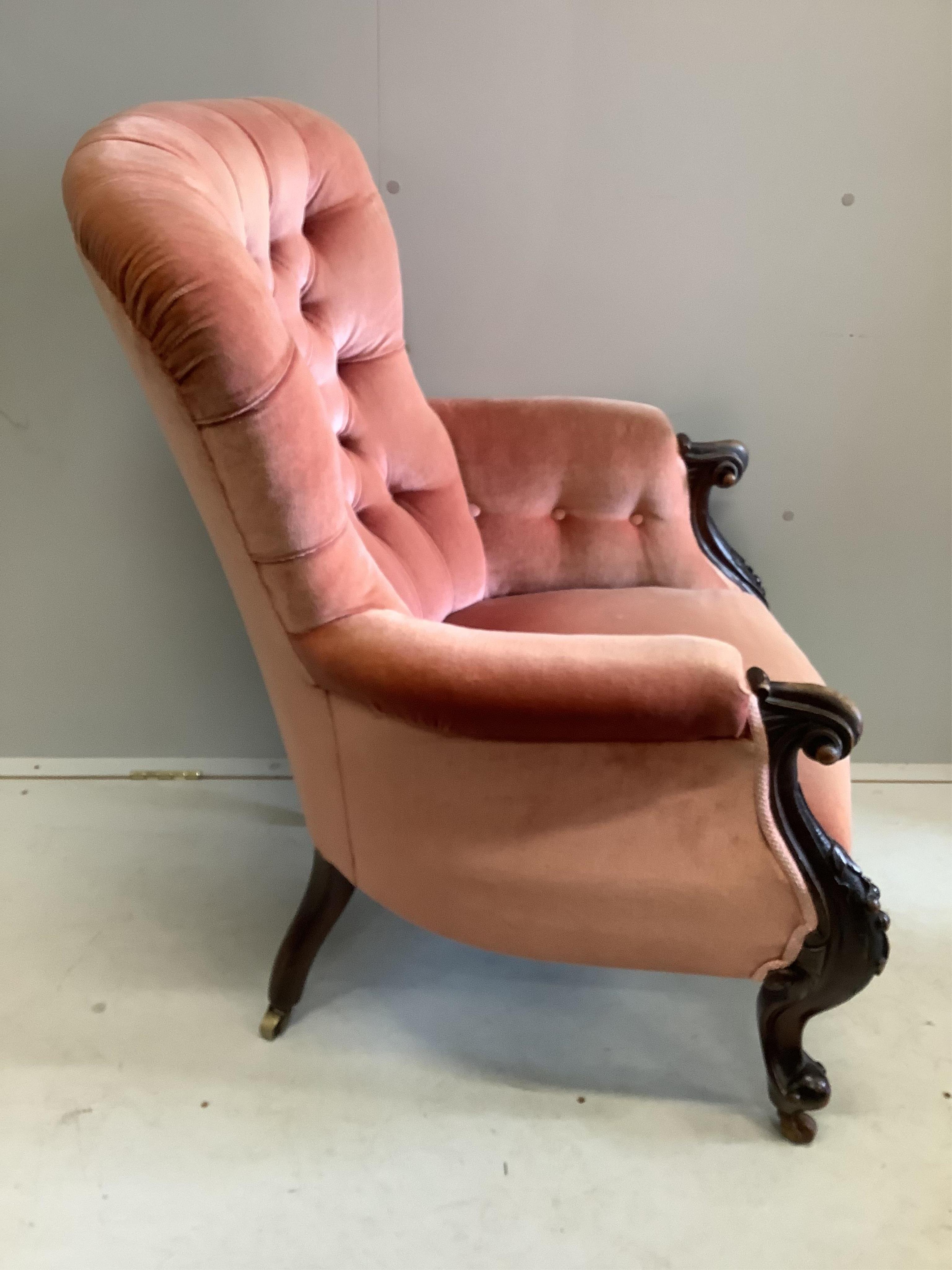 A Victorian mahogany upholstered spoon back armchair, width 70cm, depth 70cm, height 100cm